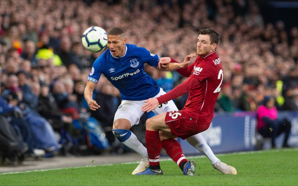 Liverpool, United Kingdom - LIVERPOOL, UK 3RD MARCH - Richarlison of Everton FC is challenged by Andy Robertson of Liverpool during the Premier League match between Everton and Liverpool at Goodison Park