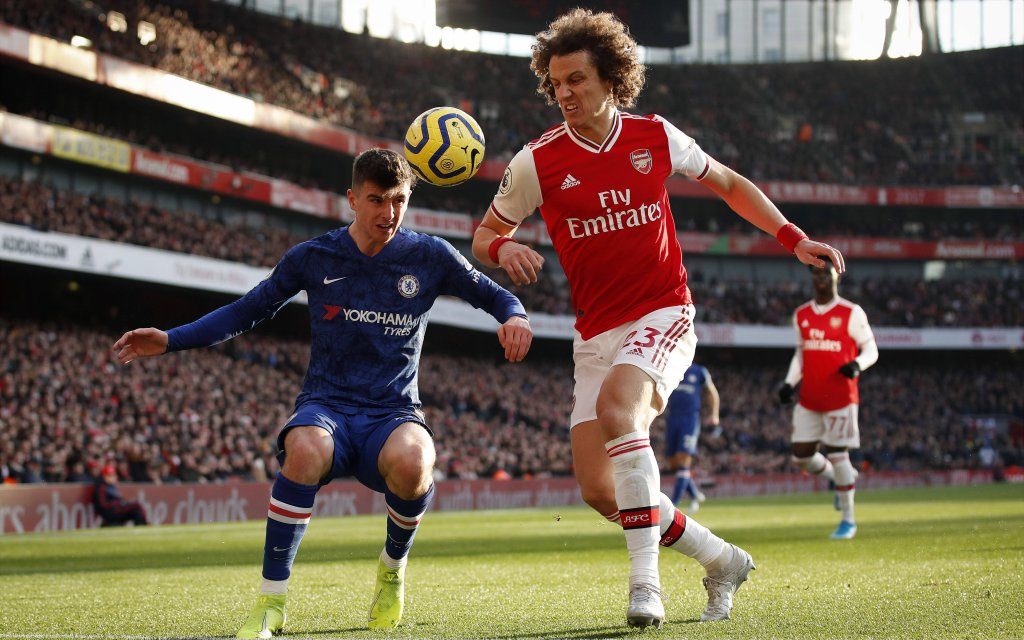 Arsenal s David Luiz tussles with Chelsea s Mason Mount during the Premier League match at the Emirates Stadium