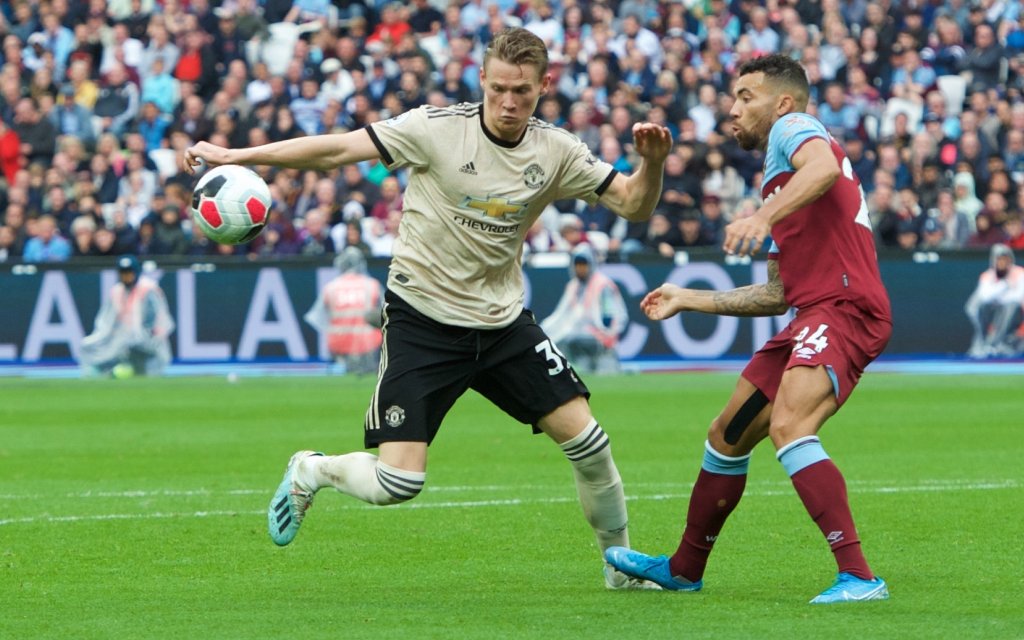 West Ham United v Manchester United, ManU Premier League Scott McTominay of Manchester United and Ryan Fredericks of West Ham United during the Premier League match at the London Stadium