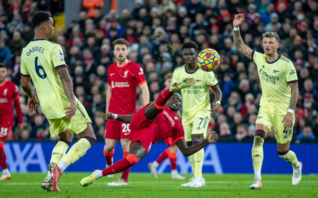 211121 -- LIVERPOOL, Nov. 21, 2021 -- Liverpool s Sadio Mane bottom shoots during the English Premier League match between Liverpool and Arsenal in Liverpool, Britain, on Nov. 20, 2021. Liverpool won 4-0
