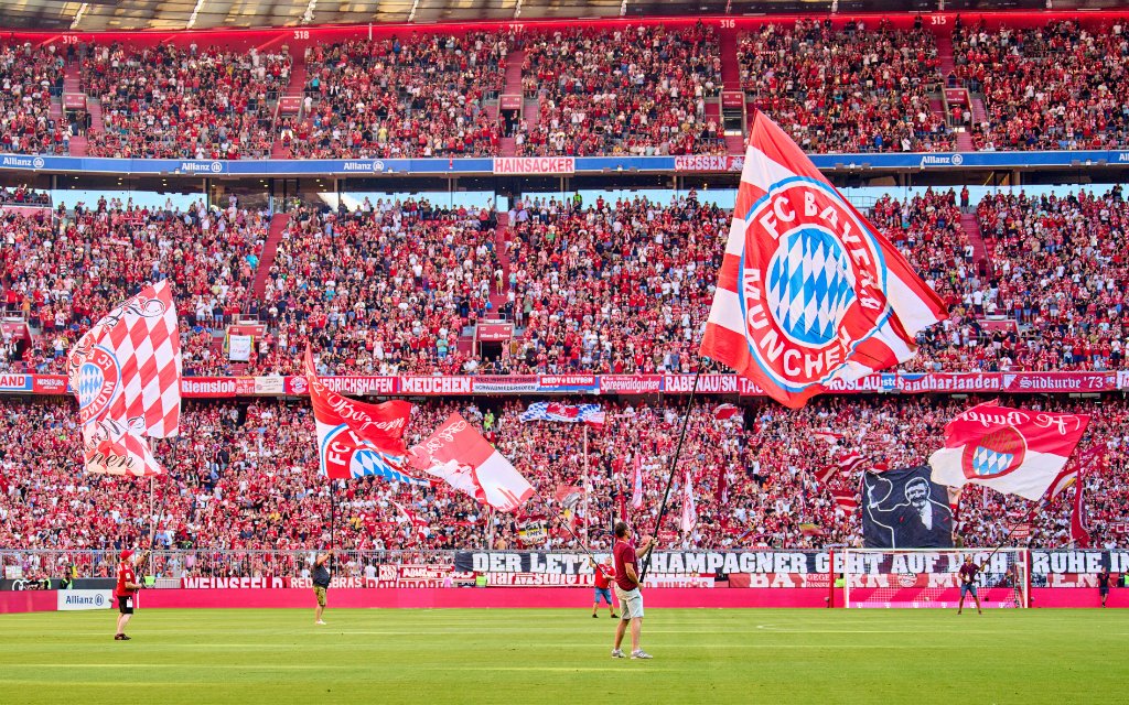 Fans with flags in the match FC BAYERN MÜNCHEN - VFL WOLFSBURG 2-0 1.German Football League on Aug 14, 2022 in Munich, Germany. Season 2022/2023,